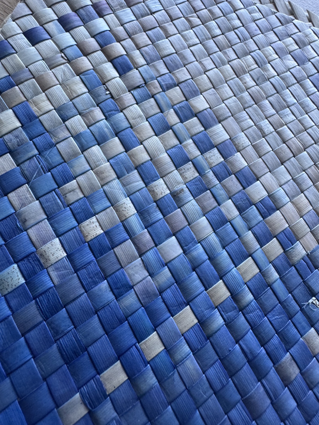 Blue and natural handwoven pandanus, close detail